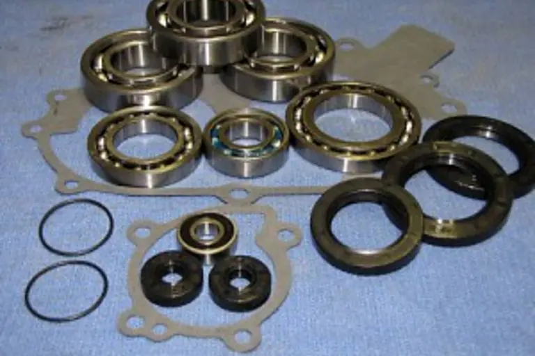 Polaris 350/400 bottom end bearing kit laid out — bearings, seals, o-rings and gaskets