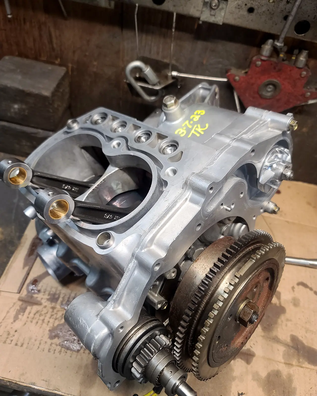 Split Polaris case with the flywheel and gear train exposed part-way through a rebuild