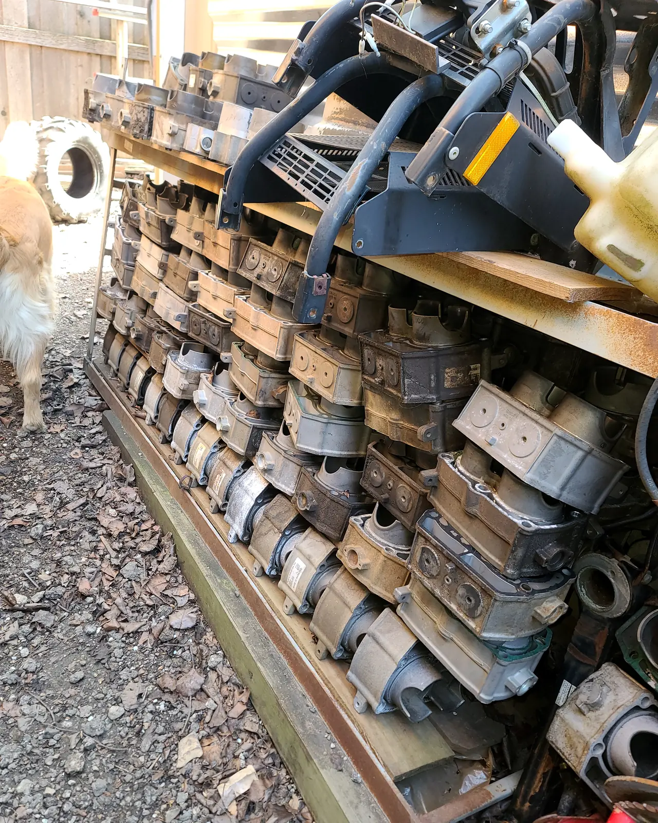 Rows of used Polaris cylinders stacked on a rack outside the shop