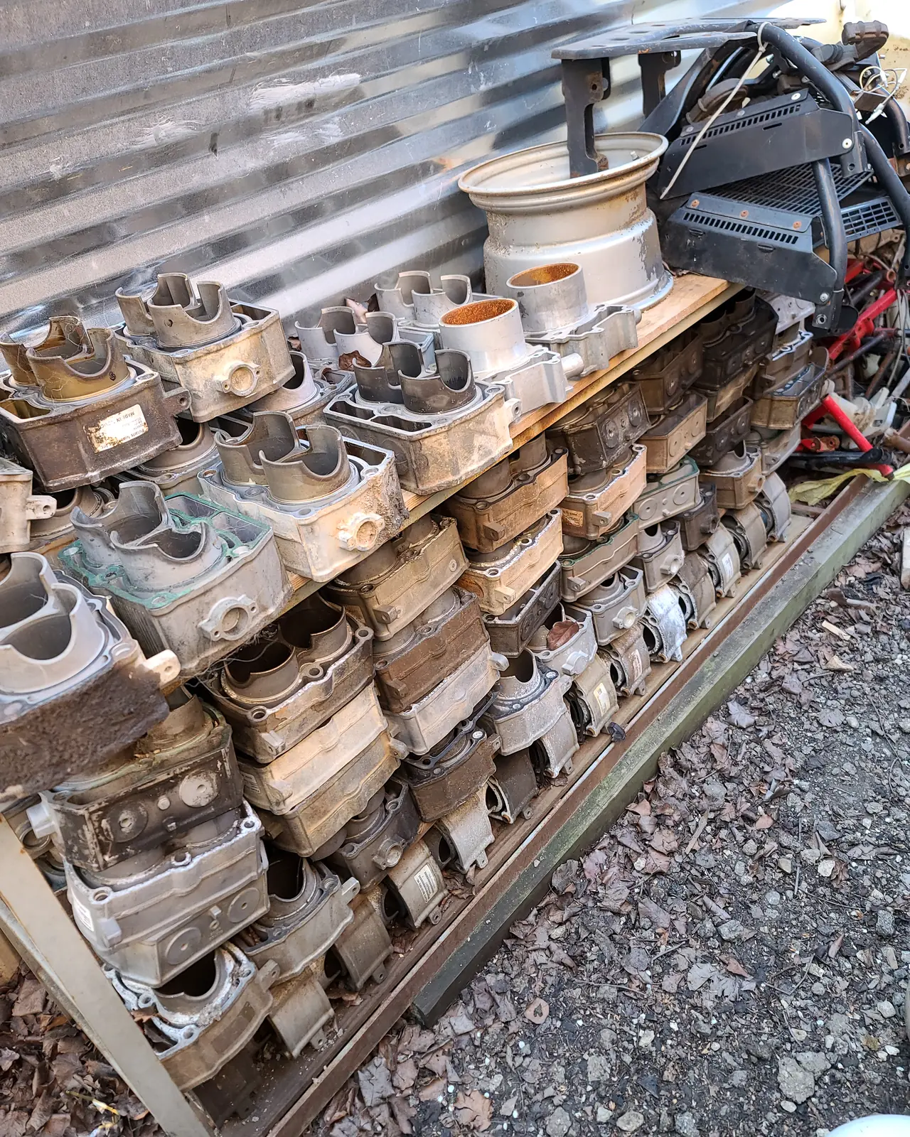 Dozens of used Polaris cylinders packed in rows, kept as core stock at the shop