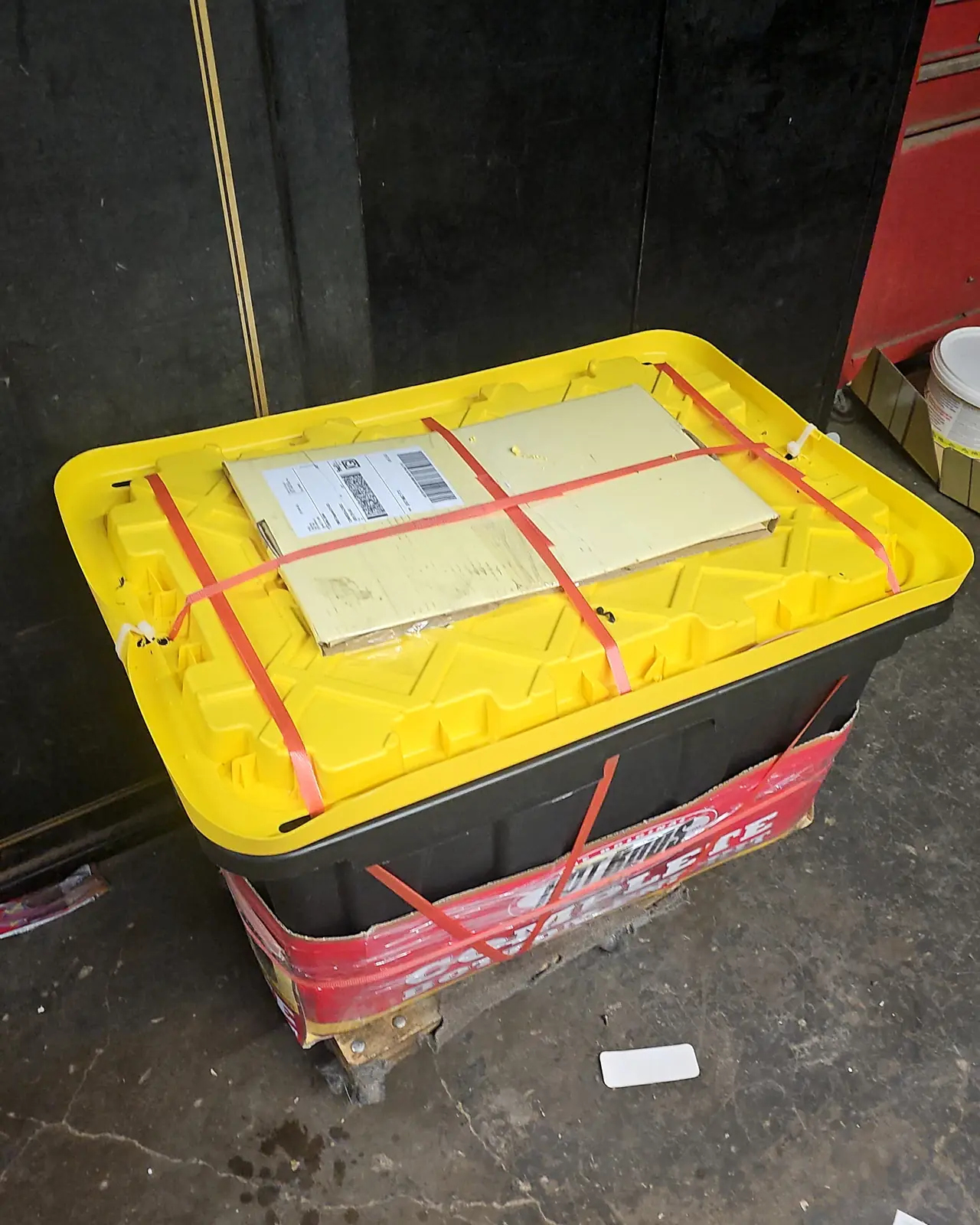 A Polaris engine packed in a strapped tote on a pallet, labelled and ready for the freight carrier