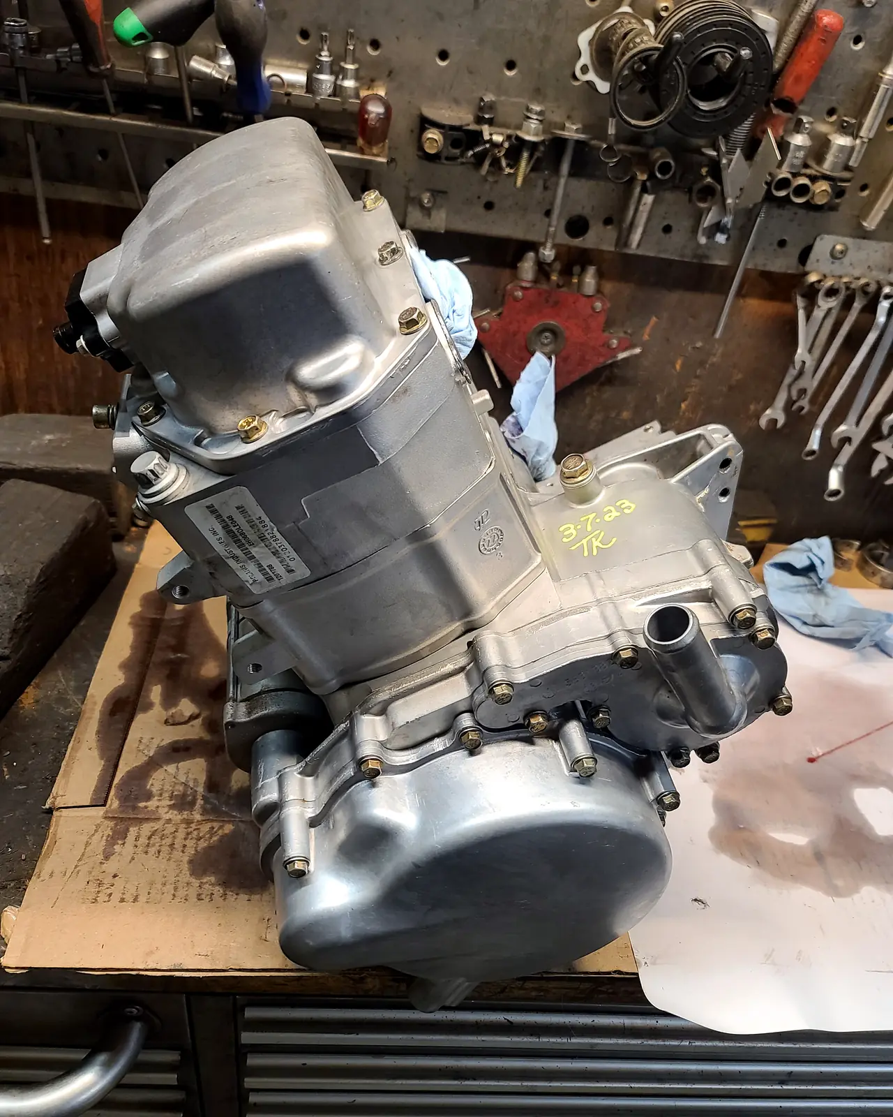 Completed Polaris engine and transmission assembly standing on the workbench